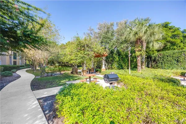 a view of a backyard with sitting area