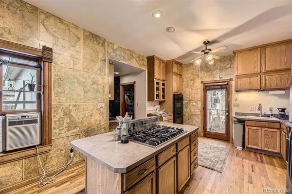 a kitchen with stainless steel appliances granite countertop a stove and a refrigerator