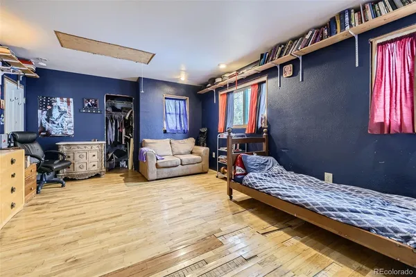 a bedroom with furniture and a window