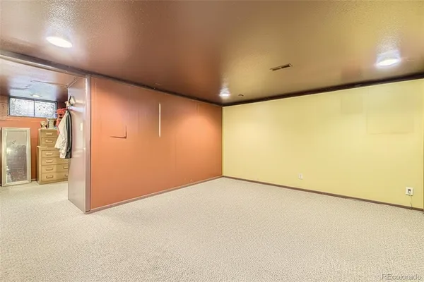 an empty room with wooden floor