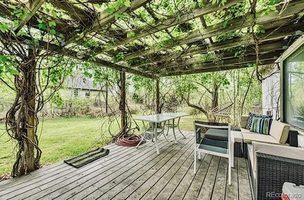 a view of roof deck with patio