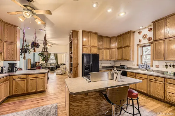 a kitchen with counter top space appliances and cabinets