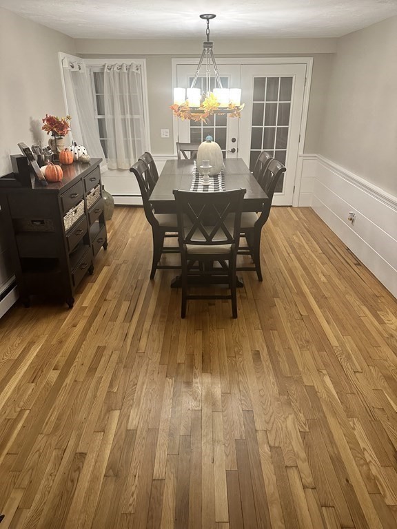4 Williams Road Sturbridge, MA 01566 - Photo 7 of 30 a view of a dining room with furniture and wooden floor