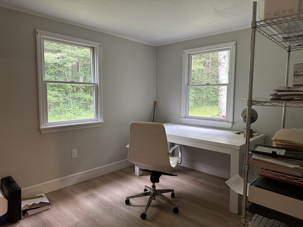 31 Harrington Road Charlton, MA 01507 - Photo 6 of 10 a view of a workspace with furniture and a window