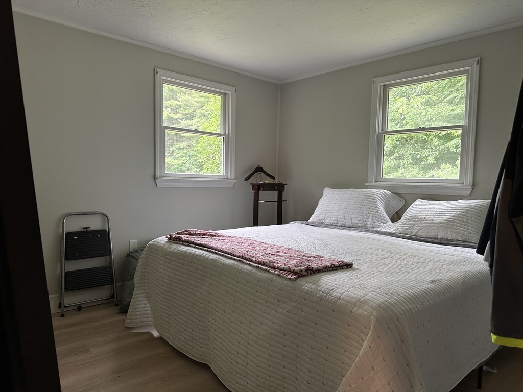 31 Harrington Road Charlton, MA 01507 - Photo 7 of 10 a bedroom with a bed and a window