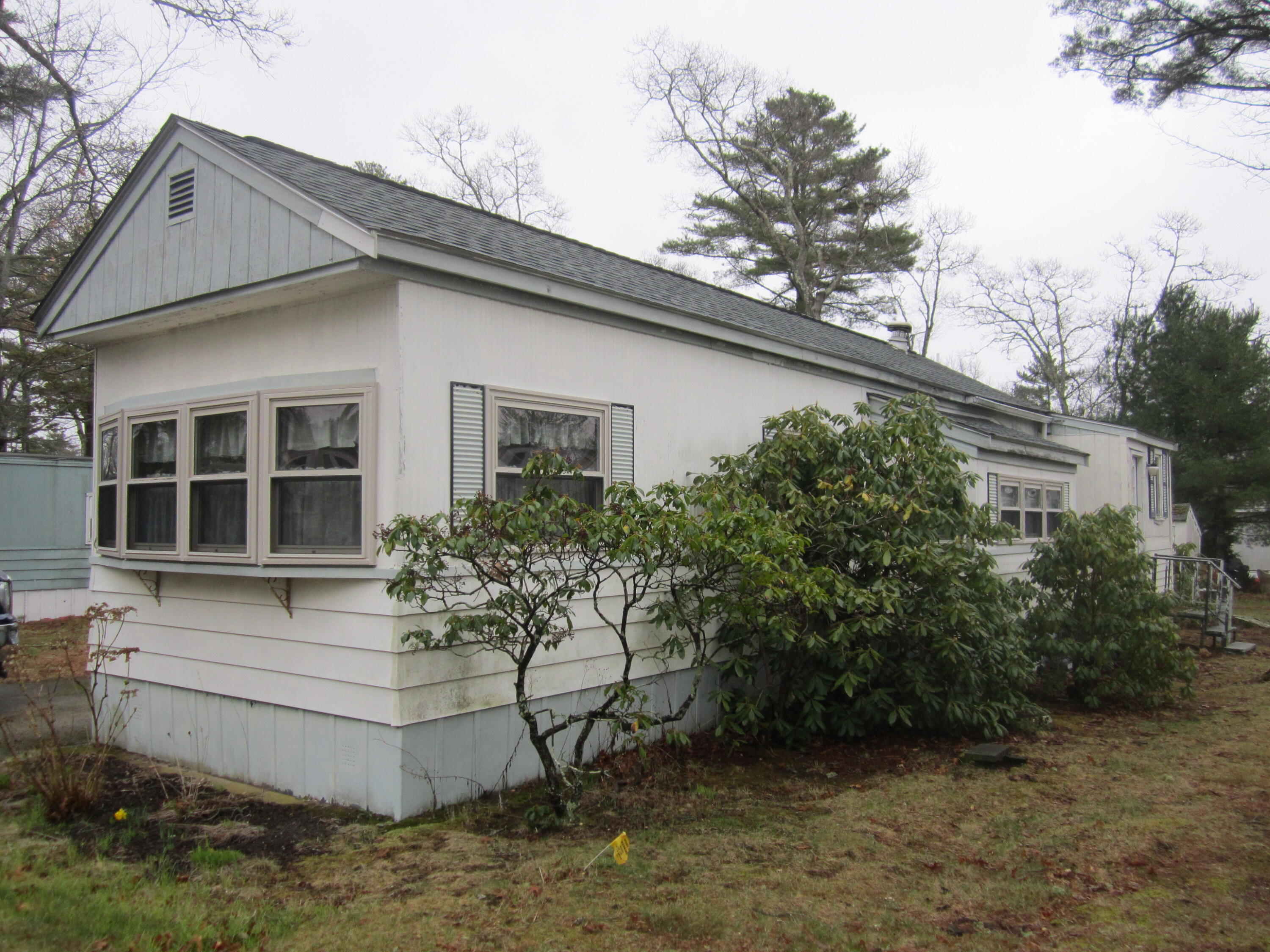 61 Timber Lane West Wareham, MA 02576 - Photo 2 of 32 a house with trees in front of it