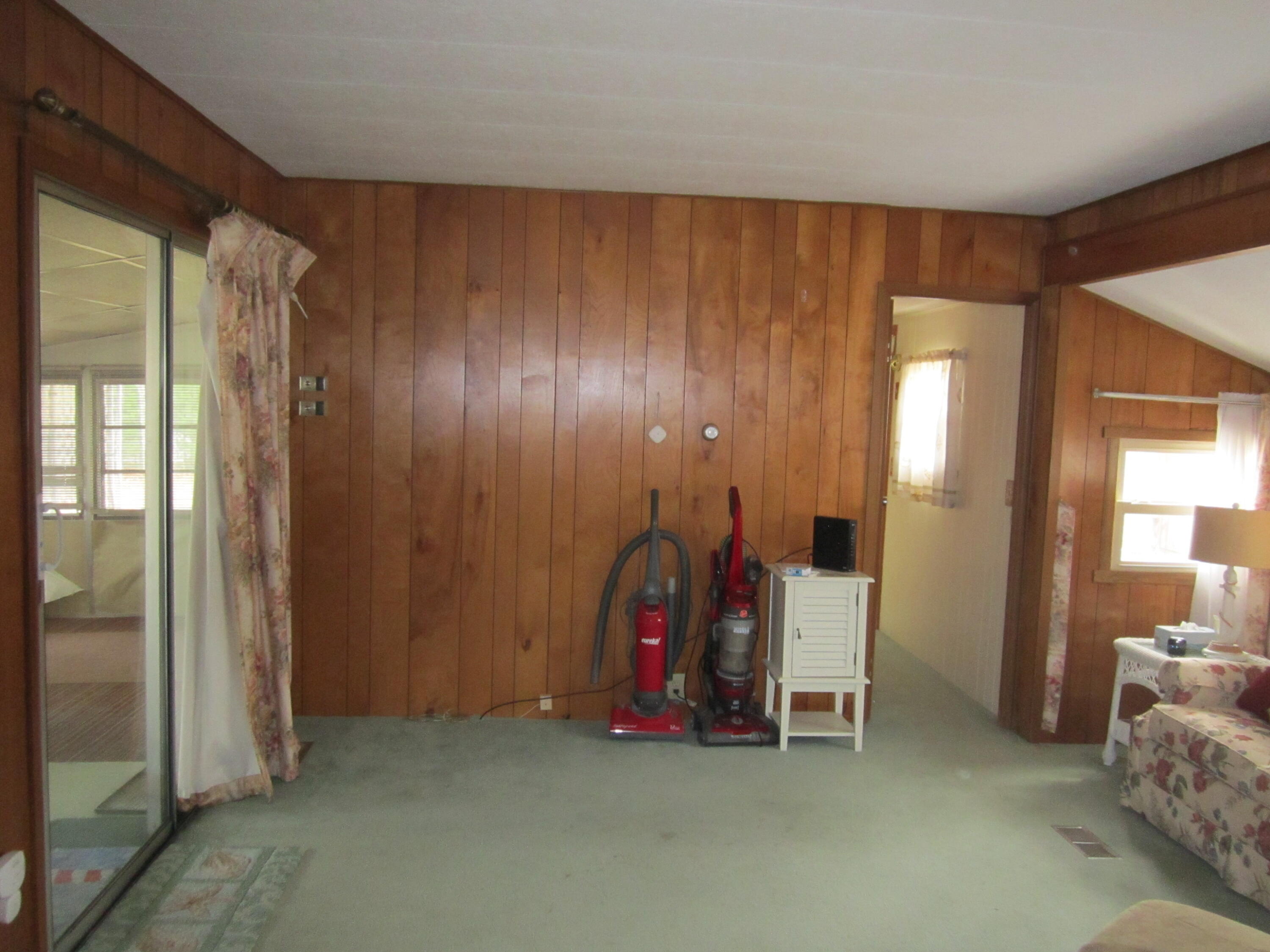 61 Timber Lane West Wareham, MA 02576 - Photo 24 of 32 a view of an empty room with wooden floor and windows