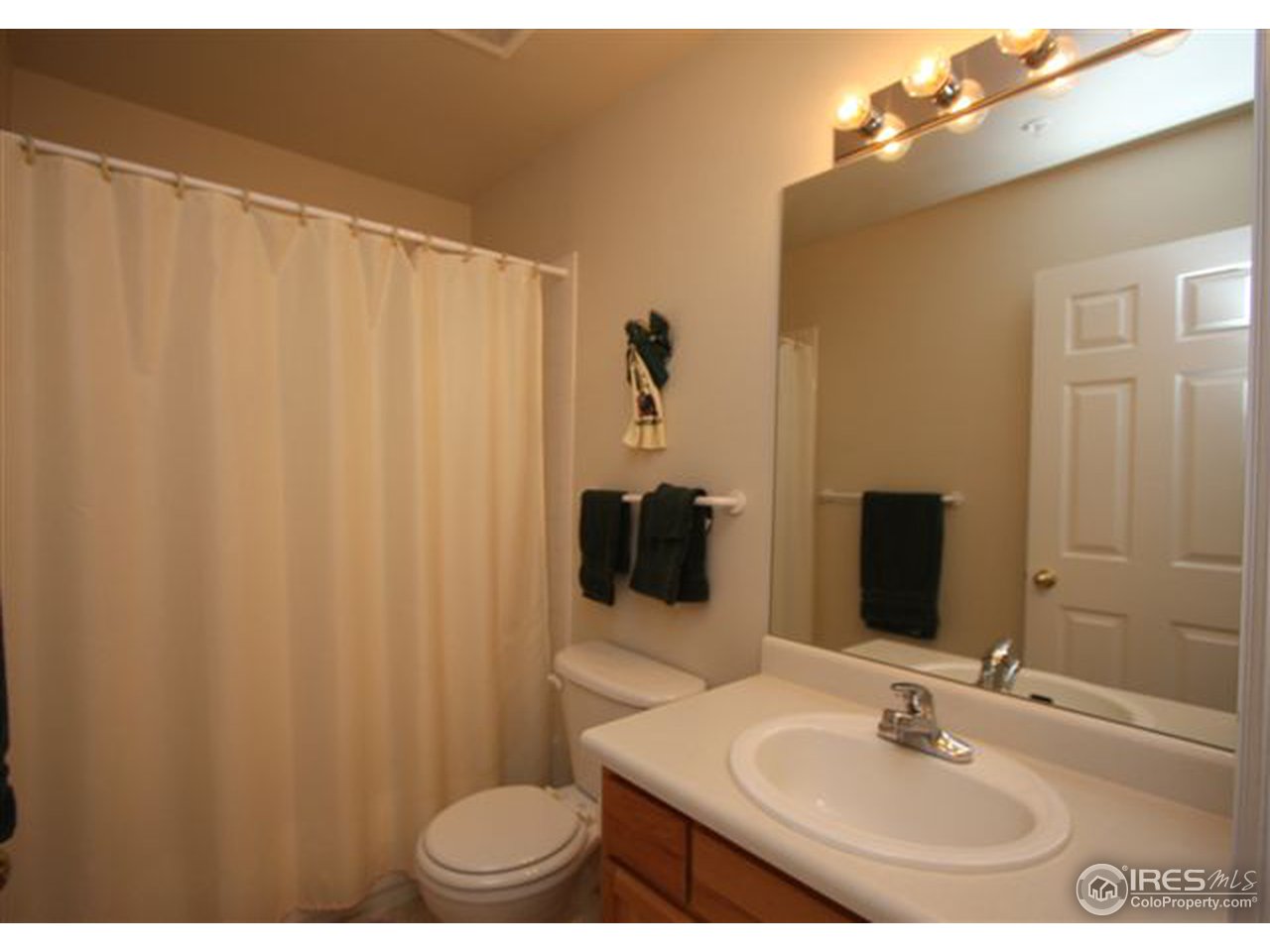 2621 Rigden Parkway, Unit C3 Fort Collins, CO 80525 - Photo 13 of 17 a bathroom with a sink and a mirror