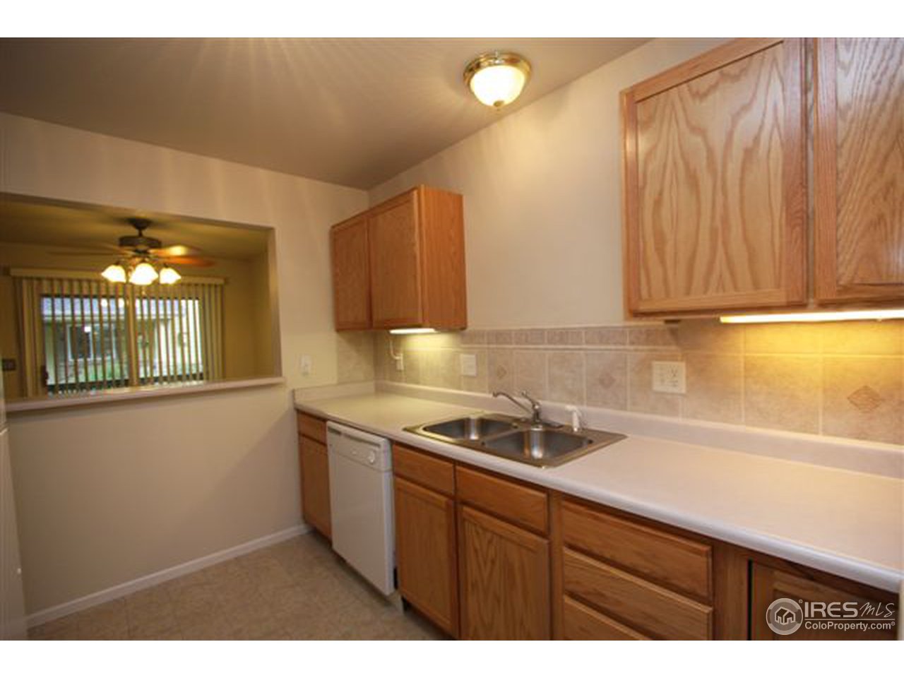 2621 Rigden Parkway, Unit C3 Fort Collins, CO 80525 - Photo 5 of 17 a kitchen with a sink and cabinets