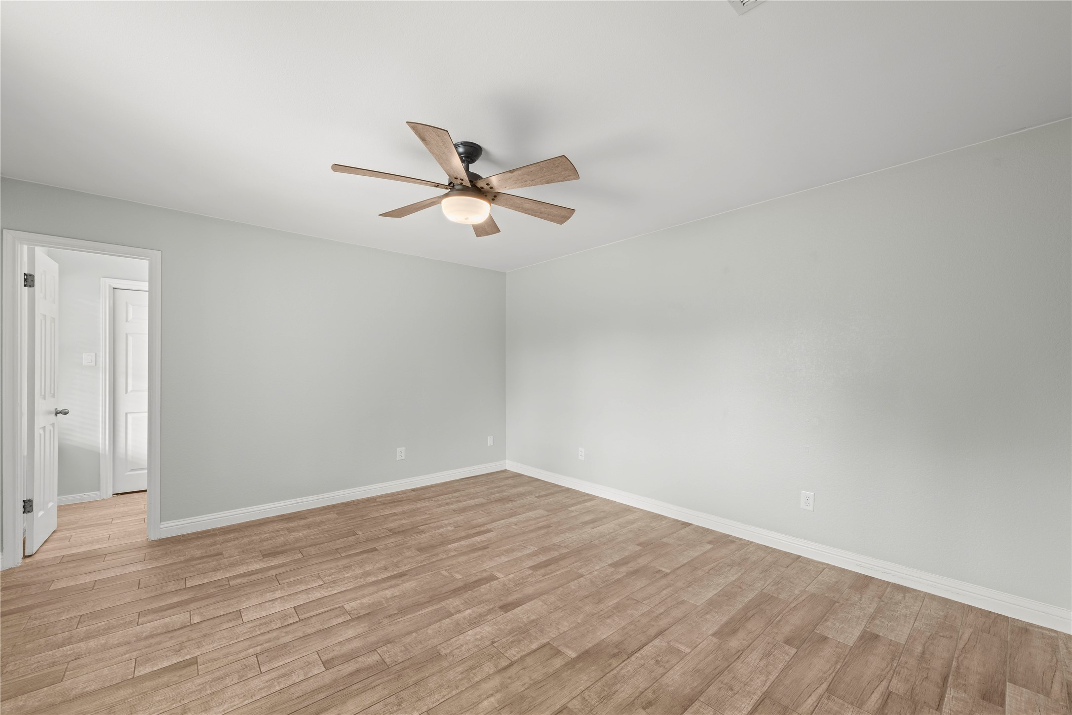 1329 Quail Ravine Round Rock, TX 78664 - Photo 29 of 39 Smooth wood-look tile flooring runs throughout this versatile and neutrally painted bedroom space.