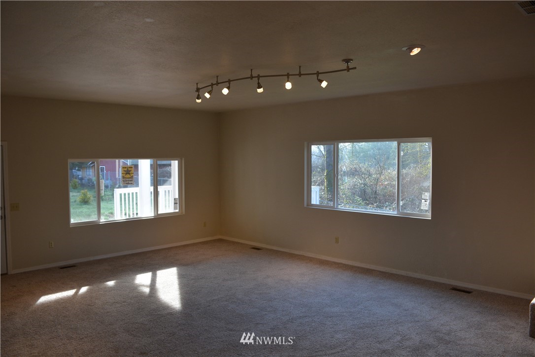 12606 Chain Lake Road Snohomish, WA 98290 - Photo 11 of 25 a view of an empty room with a window
