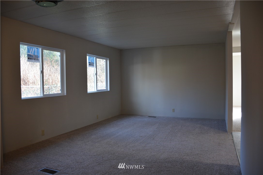 12606 Chain Lake Road Snohomish, WA 98290 - Photo 15 of 25 an empty room with windows