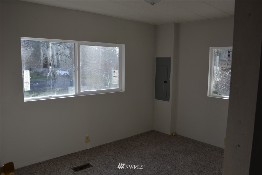 12606 Chain Lake Road Snohomish, WA 98290 - Photo 17 of 25 a view of an empty room with windows