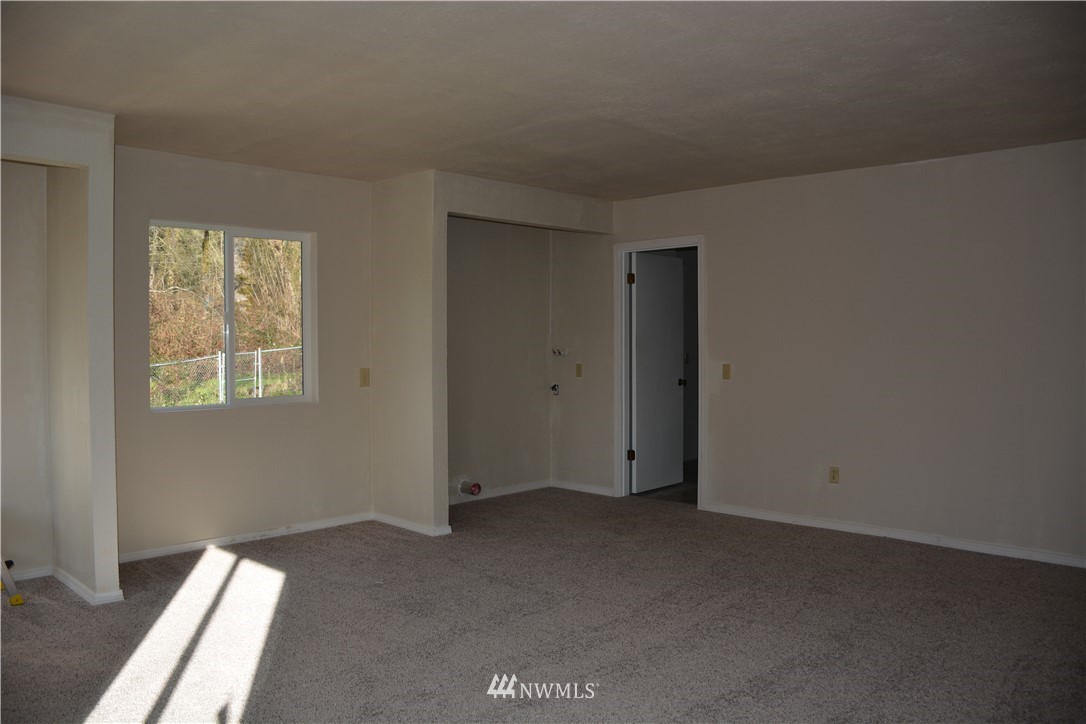 12606 Chain Lake Road Snohomish, WA 98290 - Photo 20 of 25 an empty room with windows
