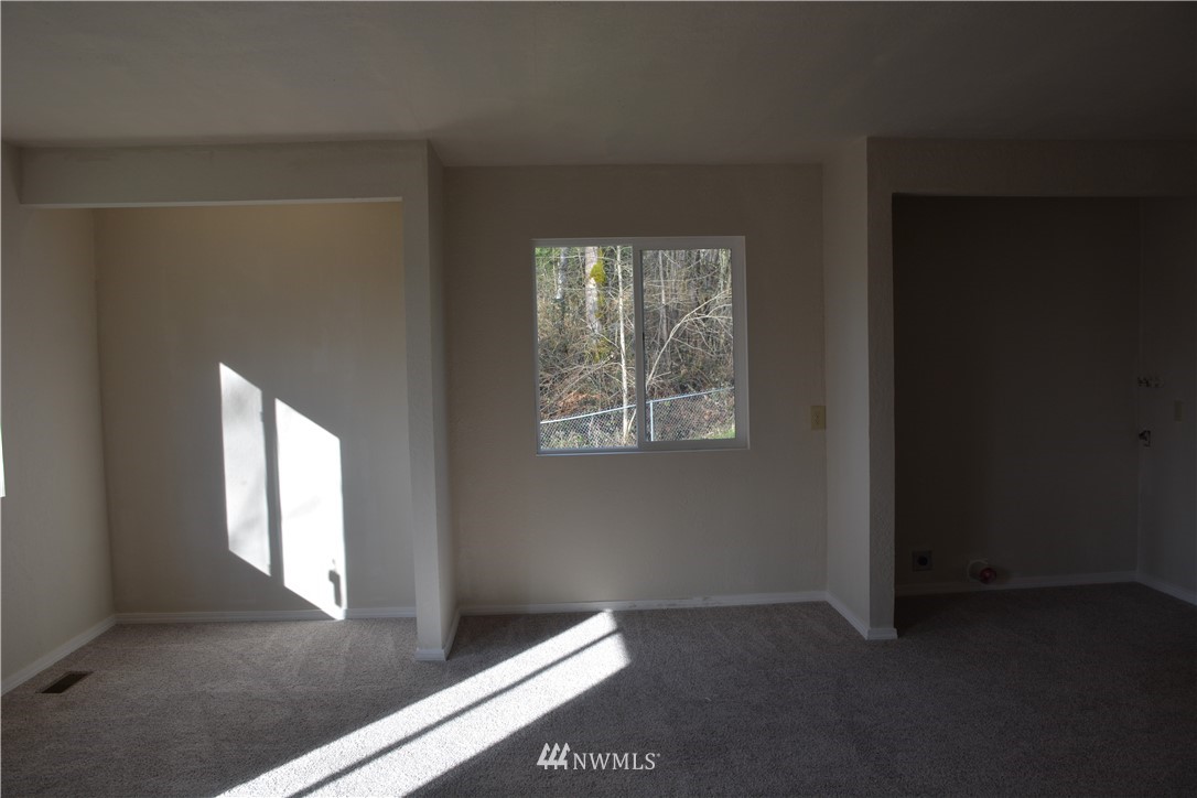12606 Chain Lake Road Snohomish, WA 98290 - Photo 21 of 25 a view of an empty room with a window