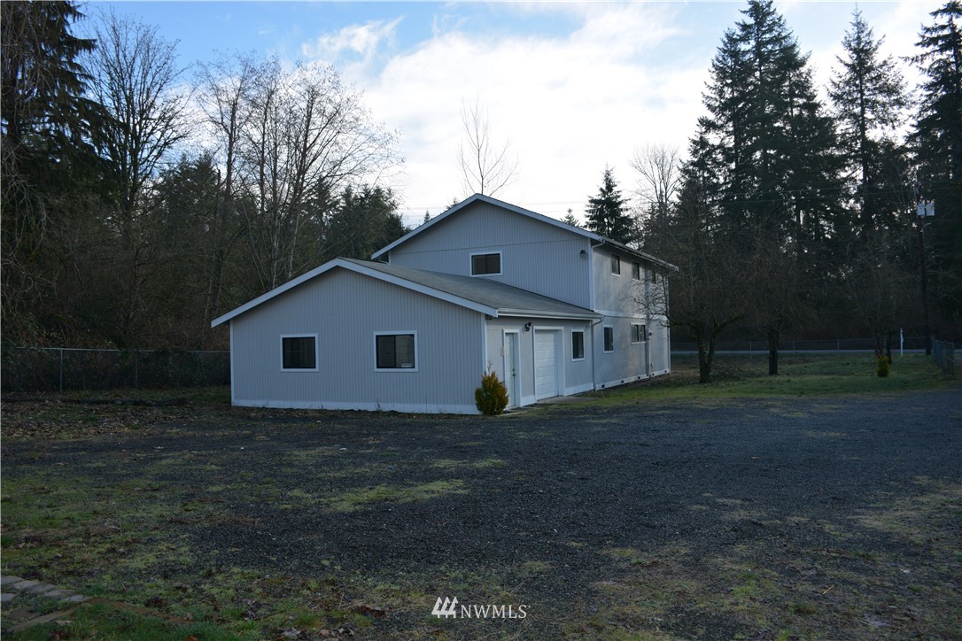 12606 Chain Lake Road Snohomish, WA 98290 - Photo 4 of 25 a house that has a tree in front of it