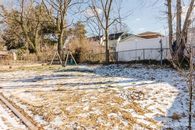a view of a backyard of the house