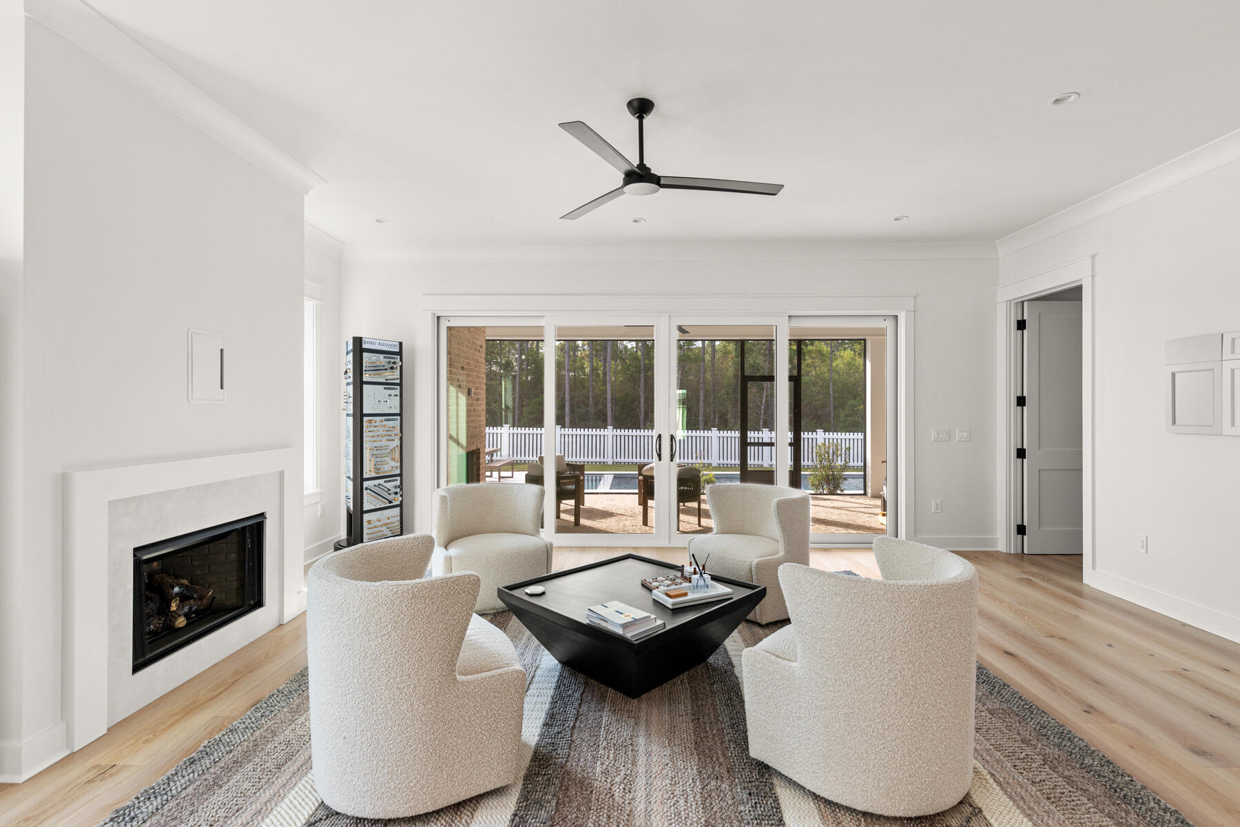 314 West Firethorn Circle, Unit LOT 33 Watersound, FL 32461 - Photo 3 of 32 a living room with furniture and a fireplace