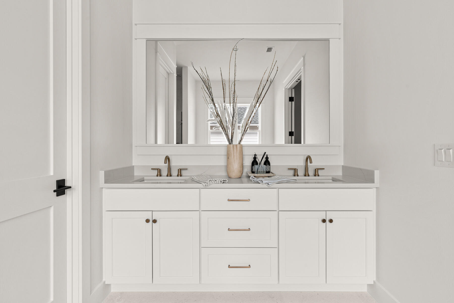 314 West Firethorn Circle, Unit LOT 33 Watersound, FL 32461 - Photo 5 of 32 a bathroom with cabinets double vanity sinks and a mirror