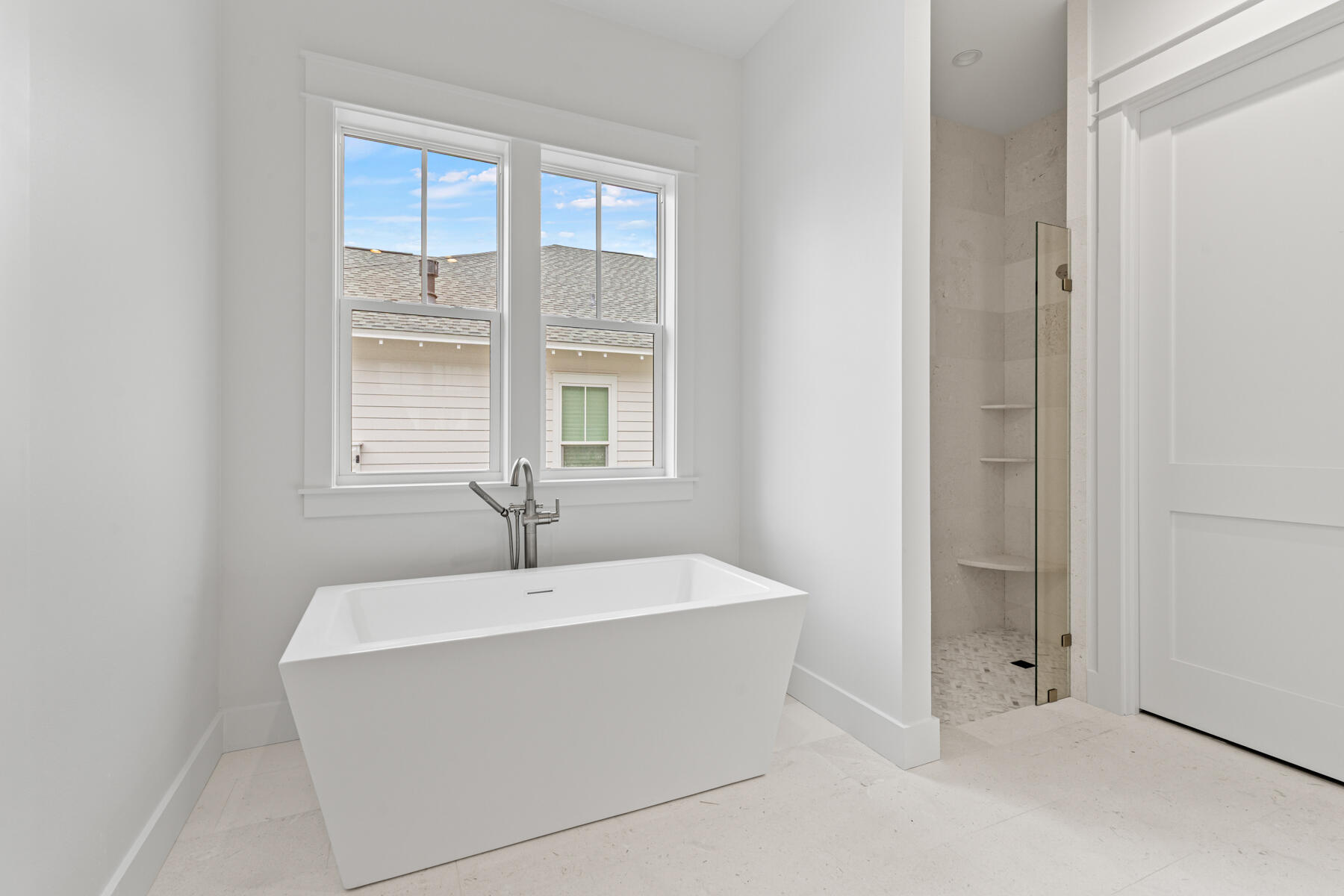 314 West Firethorn Circle, Unit LOT 33 Watersound, FL 32461 - Photo 6 of 32 a bathroom with a bathtub and shower