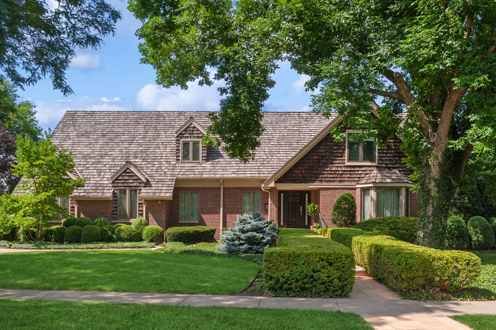 a front view of a house with a yard
