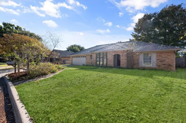 a view of a house with a yard