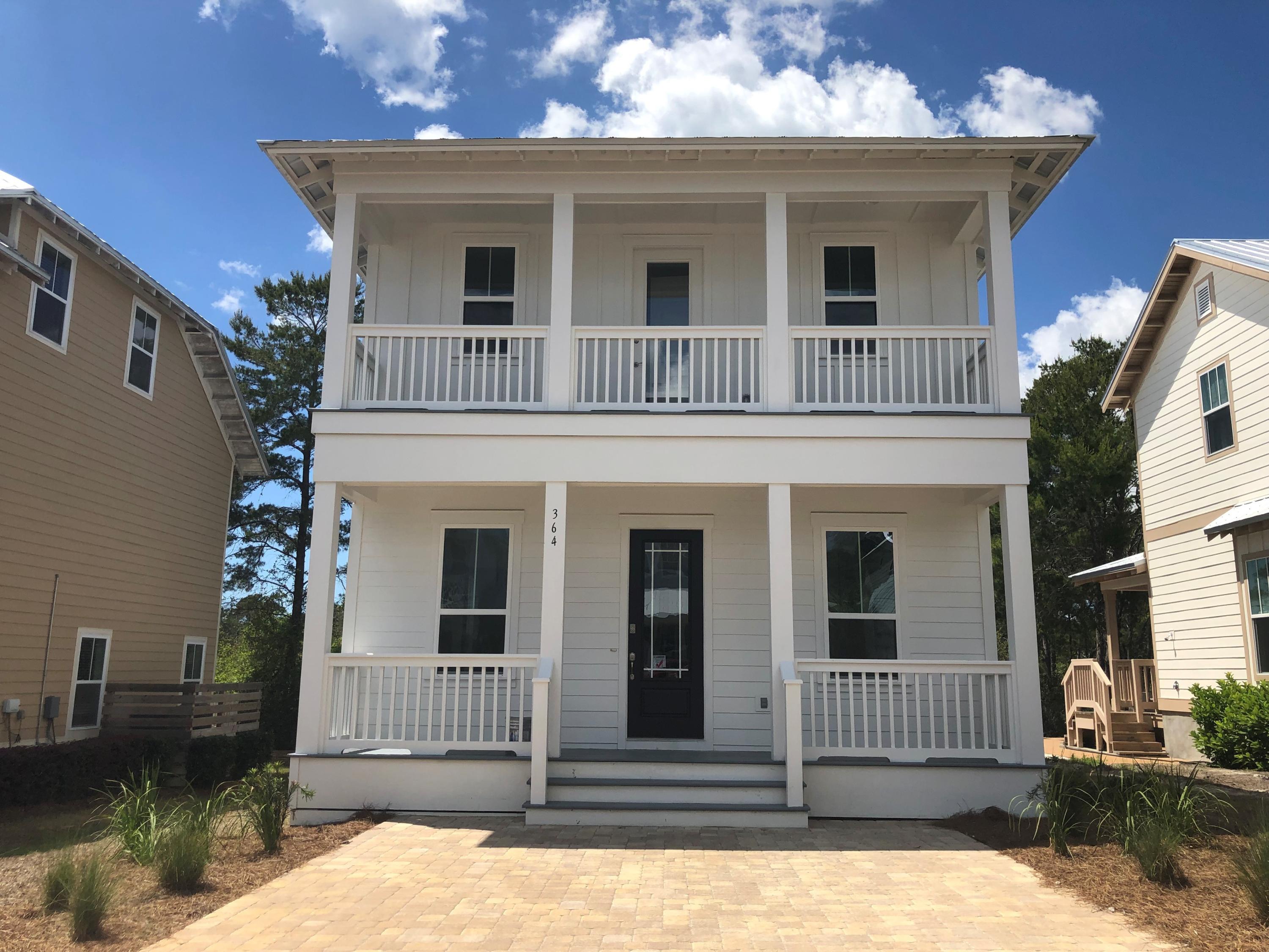 364 Grande Pointe Circle Inlet Beach, FL 32461 - Photo 1 of 33 a front view of a house with a yard