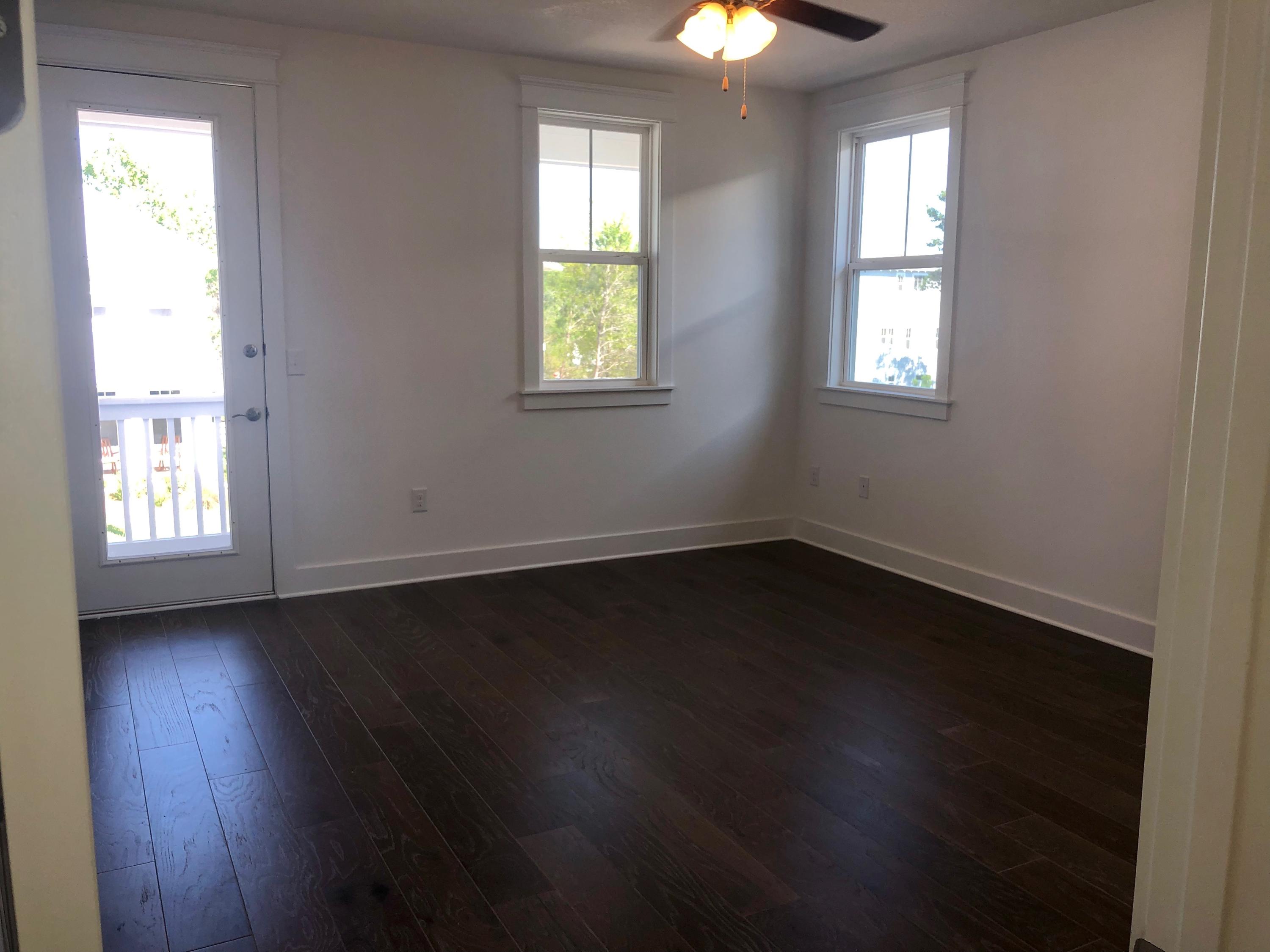 364 Grande Pointe Circle Inlet Beach, FL 32461 - Photo 14 of 33 an empty room with wooden floor and windows