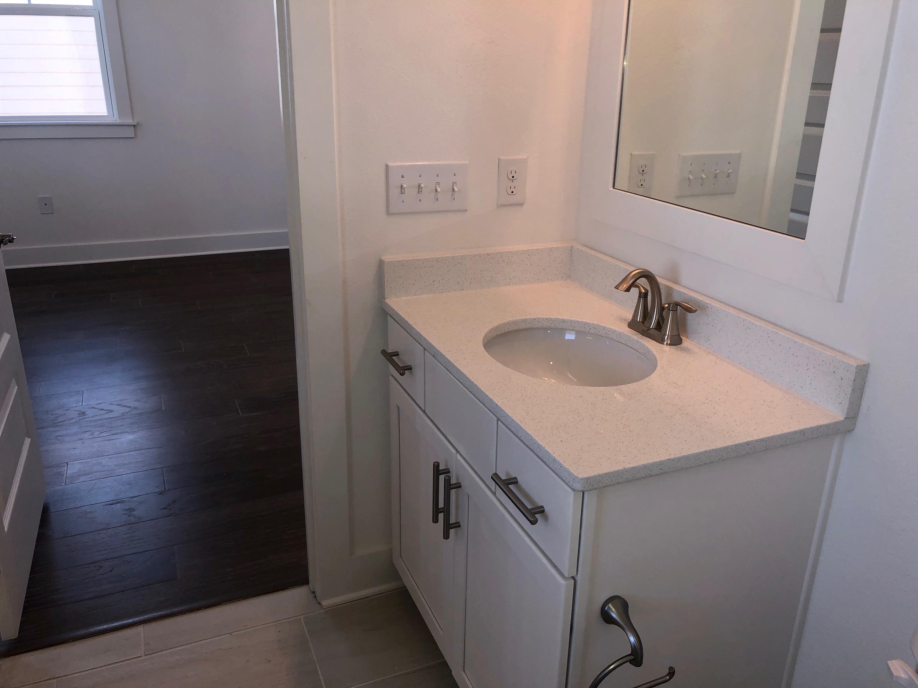 364 Grande Pointe Circle Inlet Beach, FL 32461 - Photo 16 of 33 a bathroom with a sink and a mirror