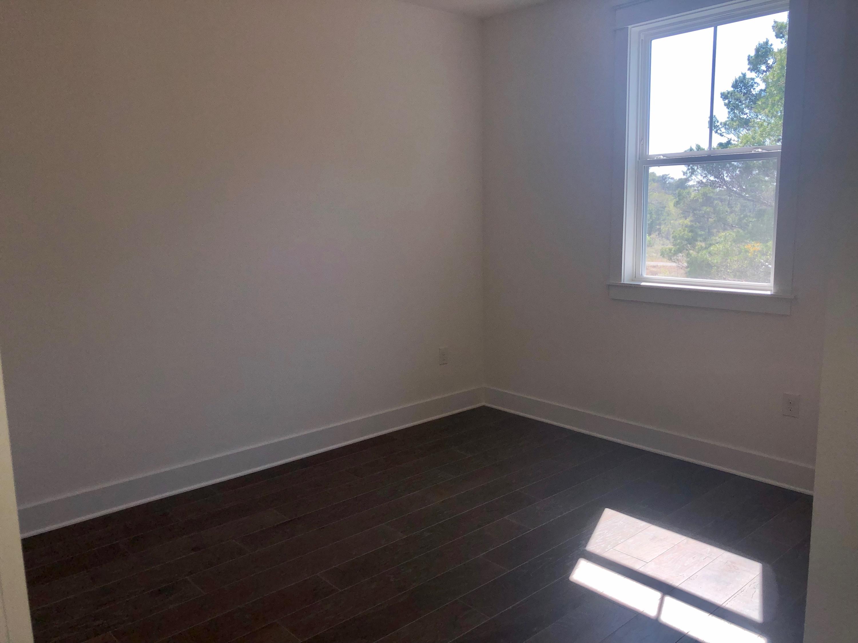 364 Grande Pointe Circle Inlet Beach, FL 32461 - Photo 18 of 33 an empty room with wooden floor and windows