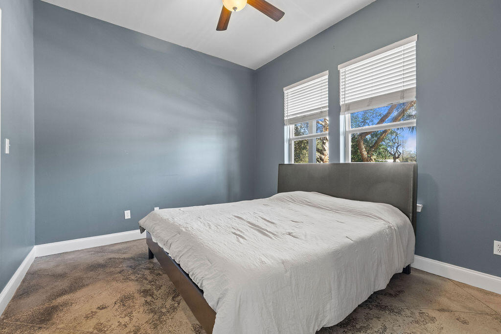 323 Main Street Destin, FL 32541 - Photo 14 of 43 a bedroom with a bed and a window