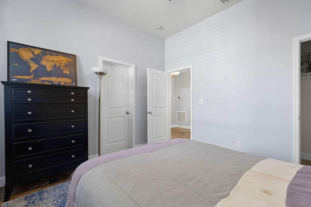 323 Main Street Destin, FL 32541 - Photo 22 of 43 a bedroom with a bed and a flat screen tv