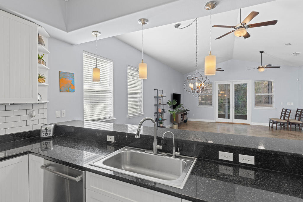 323 Main Street Destin, FL 32541 - Photo 28 of 43 a kitchen with a sink appliances and a counter space