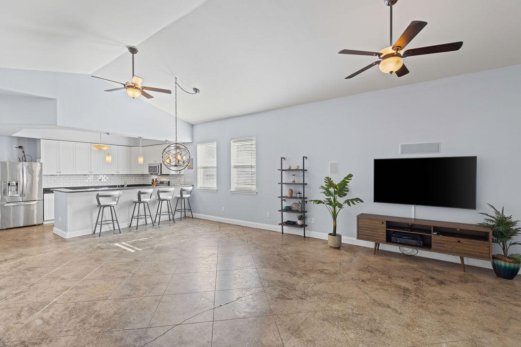 323 Main Street Destin, FL 32541 - Photo 29 of 43 a living room with furniture and a flat screen tv