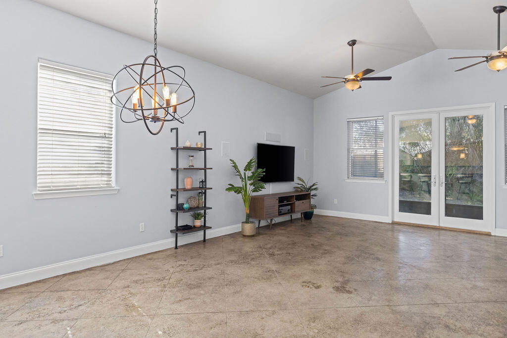 323 Main Street Destin, FL 32541 - Photo 31 of 43 a view of a livingroom with a furniture flat screen tv and window
