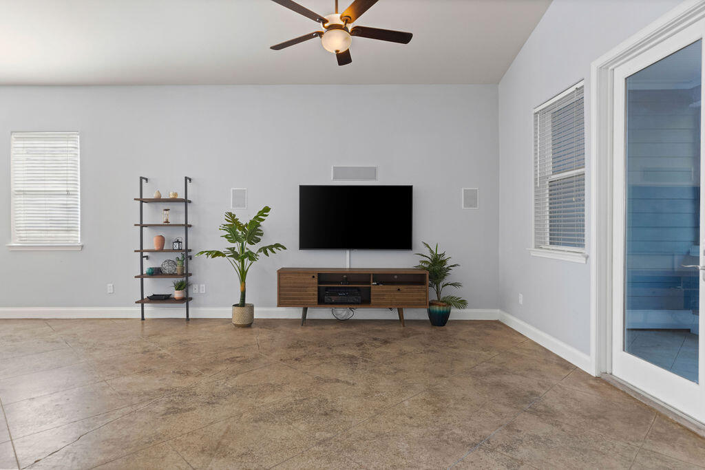 323 Main Street Destin, FL 32541 - Photo 33 of 43 a living room with furniture and a flat screen tv