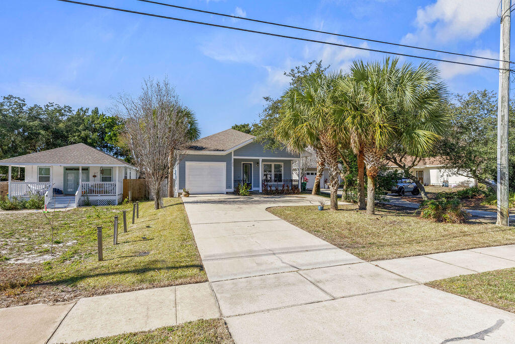 323 Main Street Destin, FL 32541 - Photo 5 of 43 a view of a house with a yard