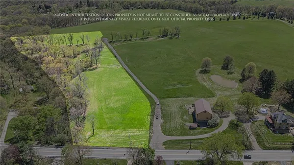 an aerial view of a houses with a lake view