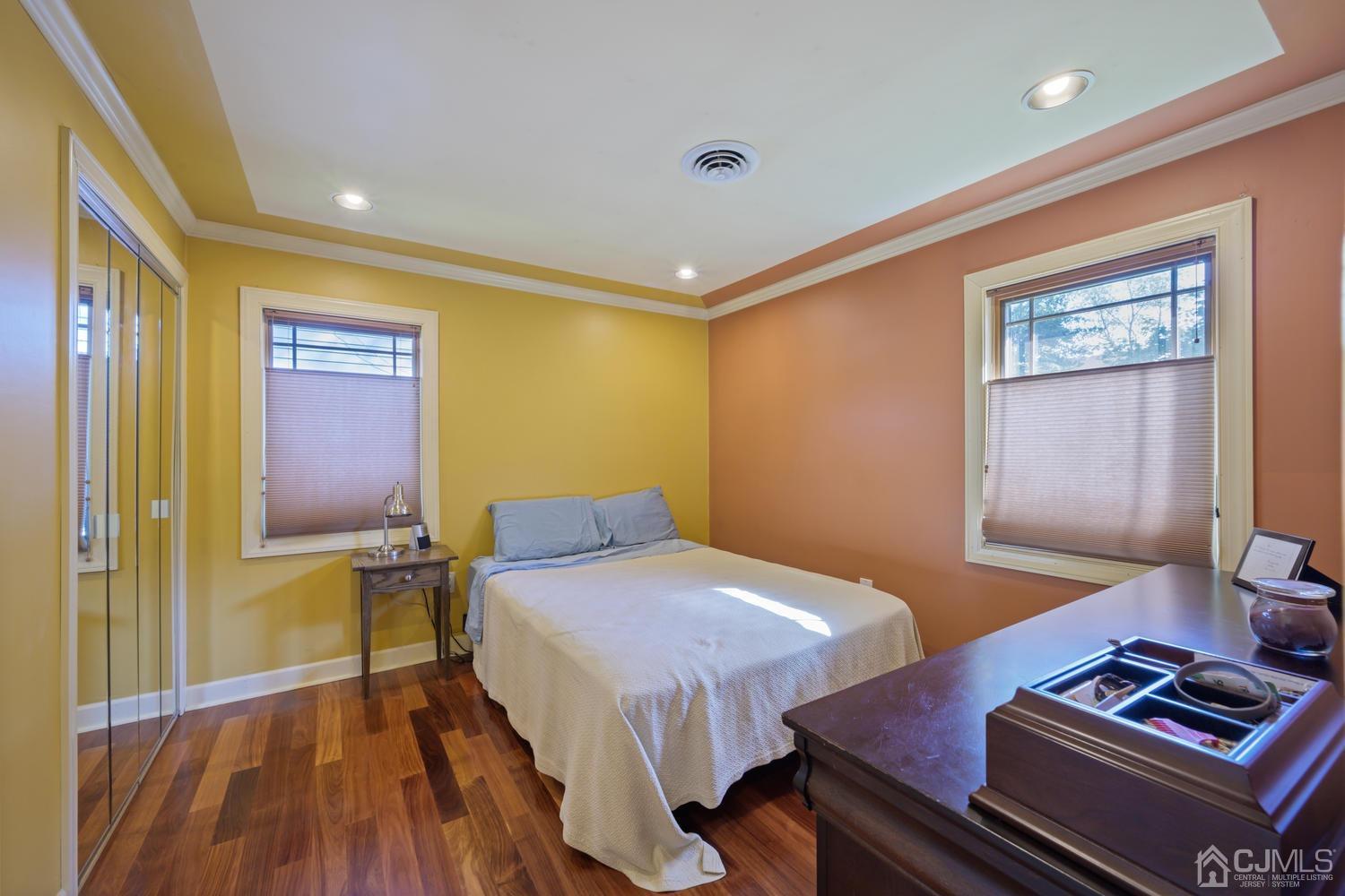 49 George Avenue Middlesex, NJ 08846 - Photo 14 of 20 a bedroom with a bed and wooden floor