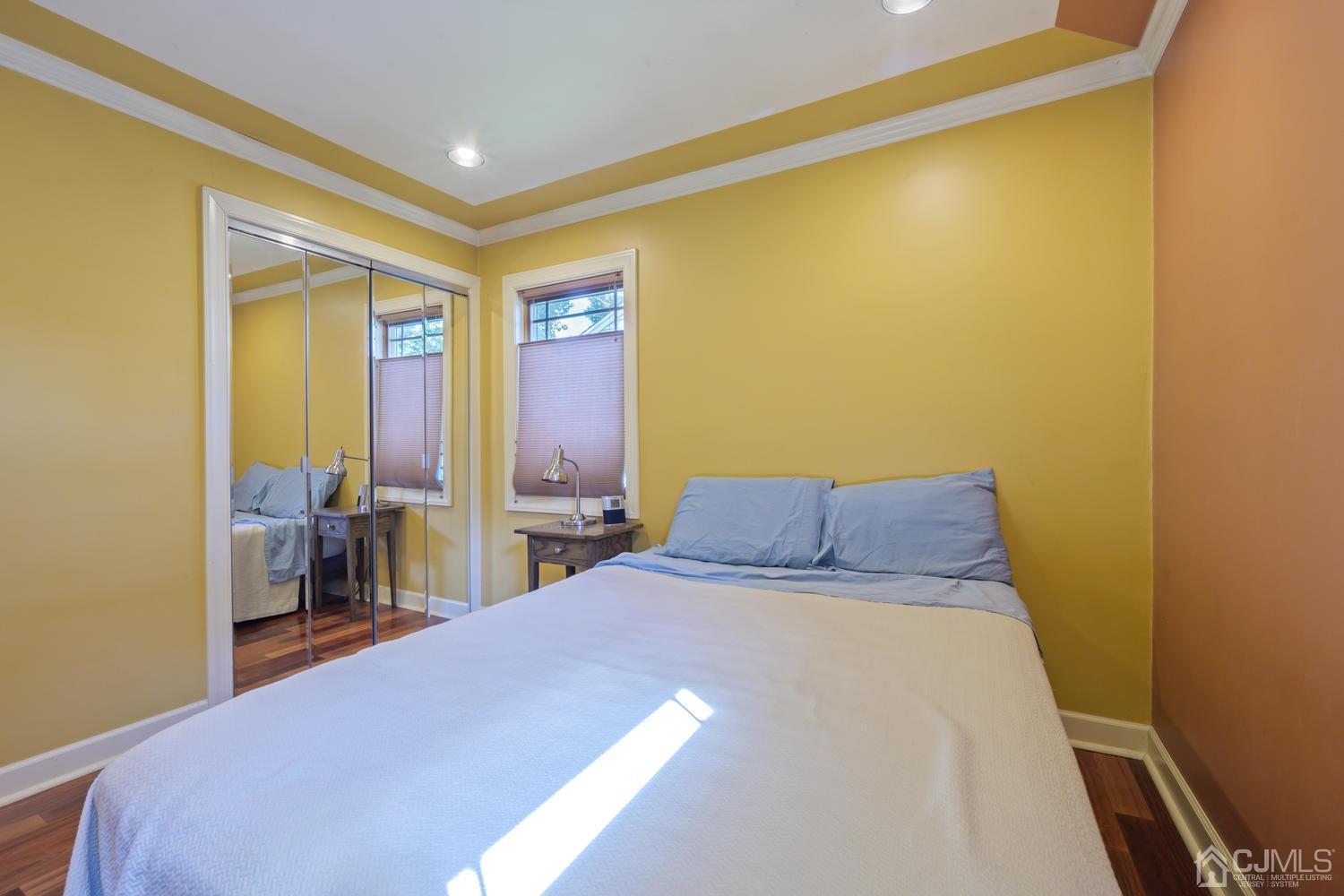 49 George Avenue Middlesex, NJ 08846 - Photo 15 of 20 a bedroom with a bed and a dresser with mirror