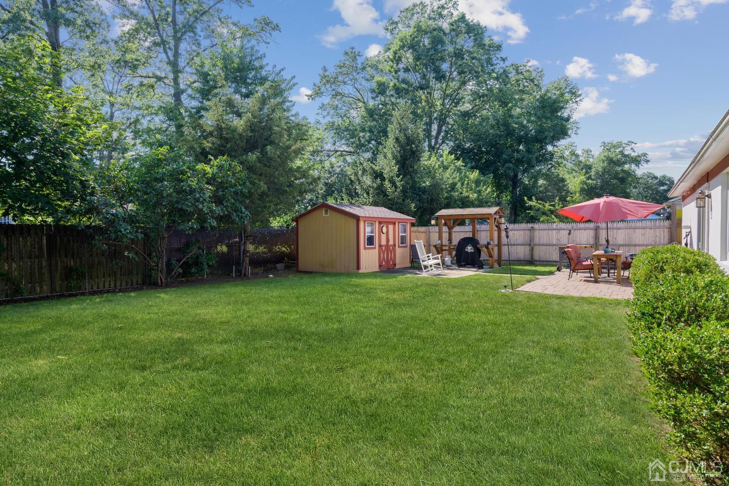 49 George Avenue Middlesex, NJ 08846 - Photo 20 of 20 a backyard of a house with table and chairs
