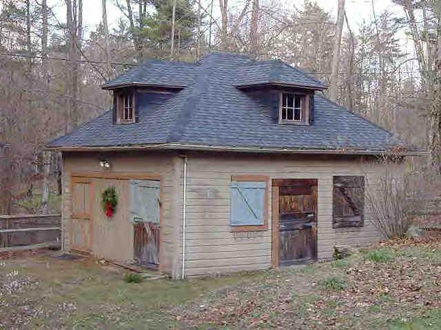 578 Main Road Monterey, MA 01245 - Photo 3 of 3 a front view of a house with garden