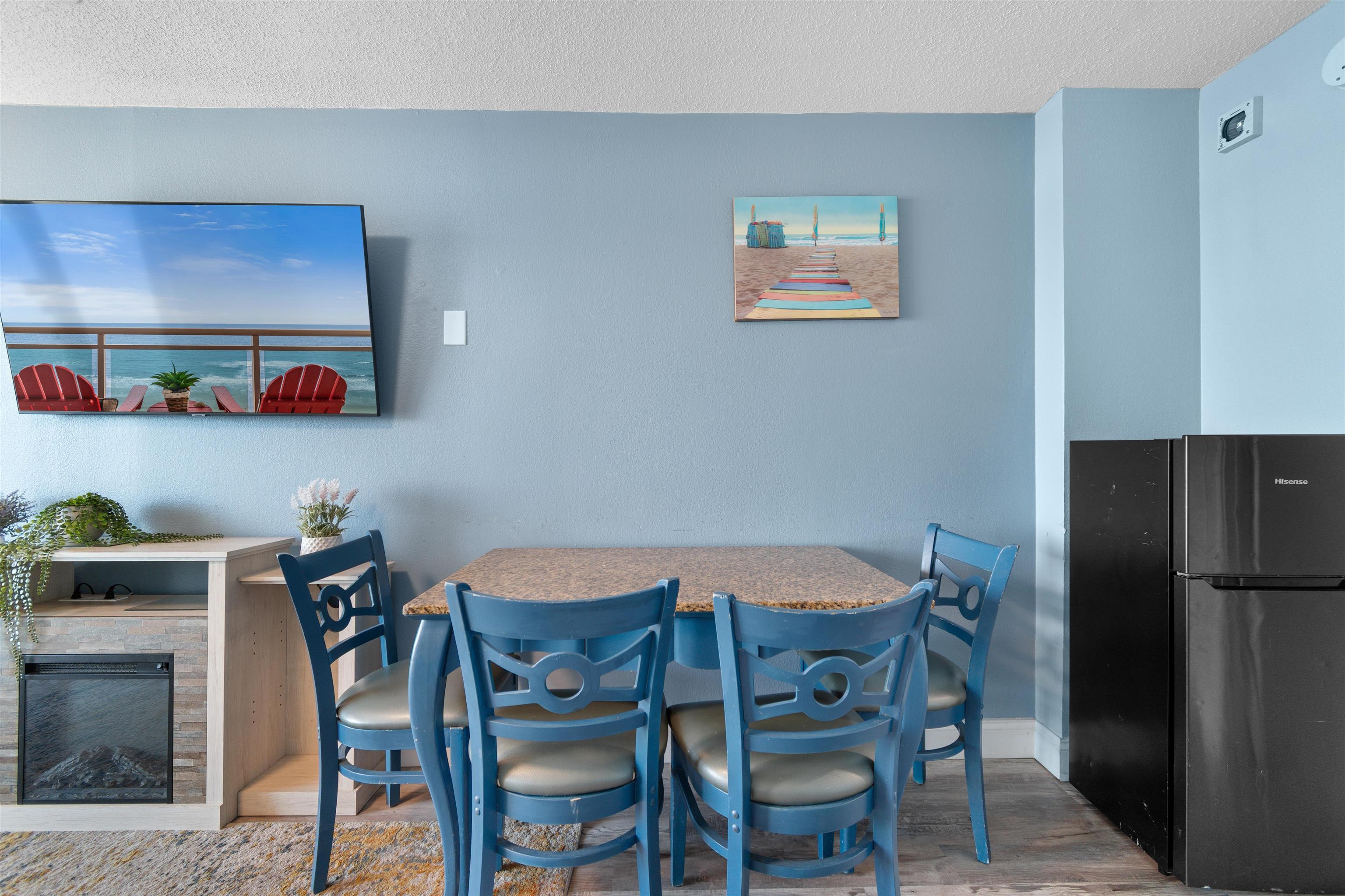 1501 South Ocean Boulevard, Unit 1237 Myrtle Beach, SC 29577 - Photo 18 of 40 Dining space featuring wood finished floors and a textured ceiling
