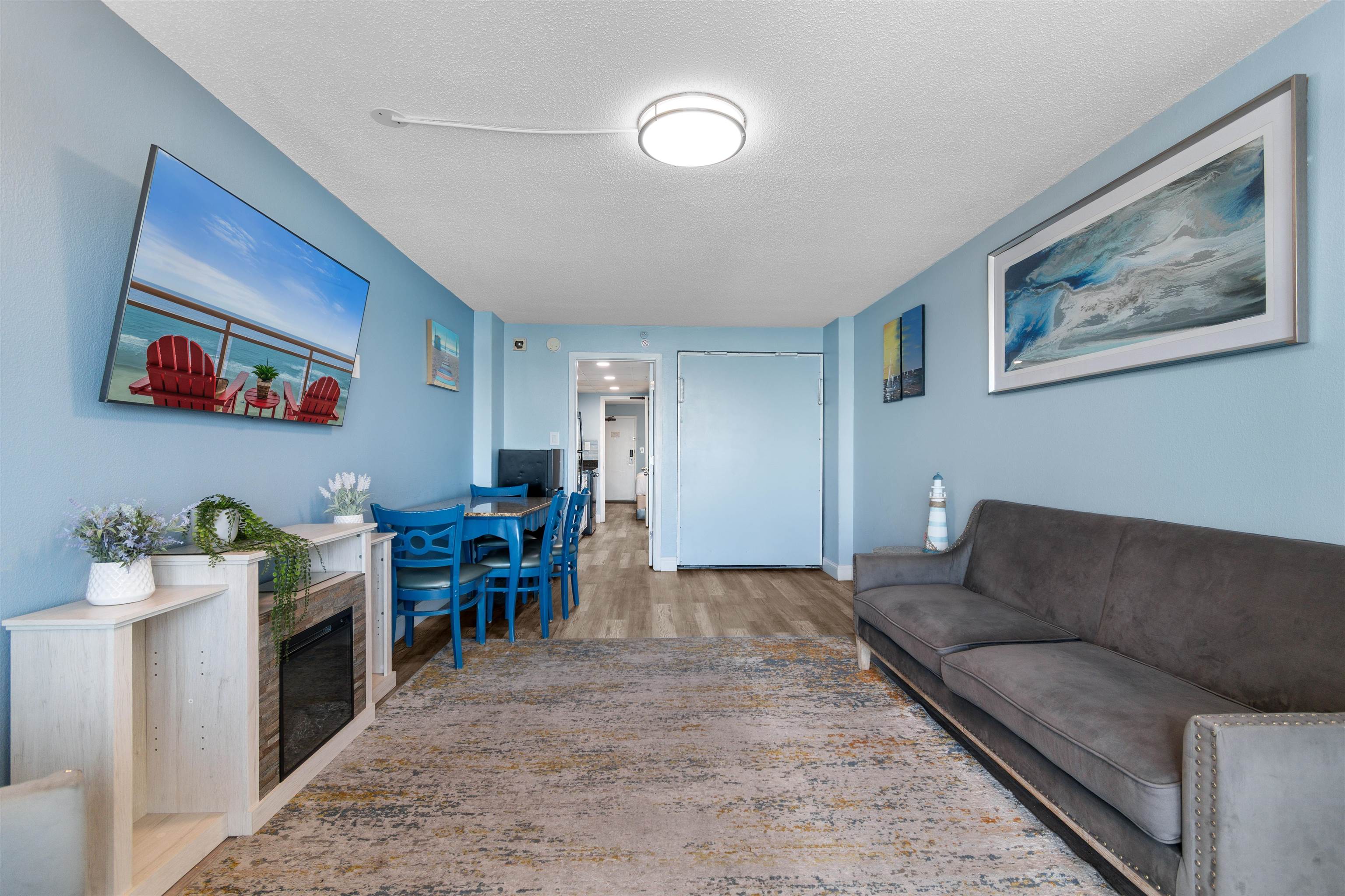 1501 South Ocean Boulevard, Unit 1237 Myrtle Beach, SC 29577 - Photo 23 of 40 Living room with a textured ceiling and wood finished floors