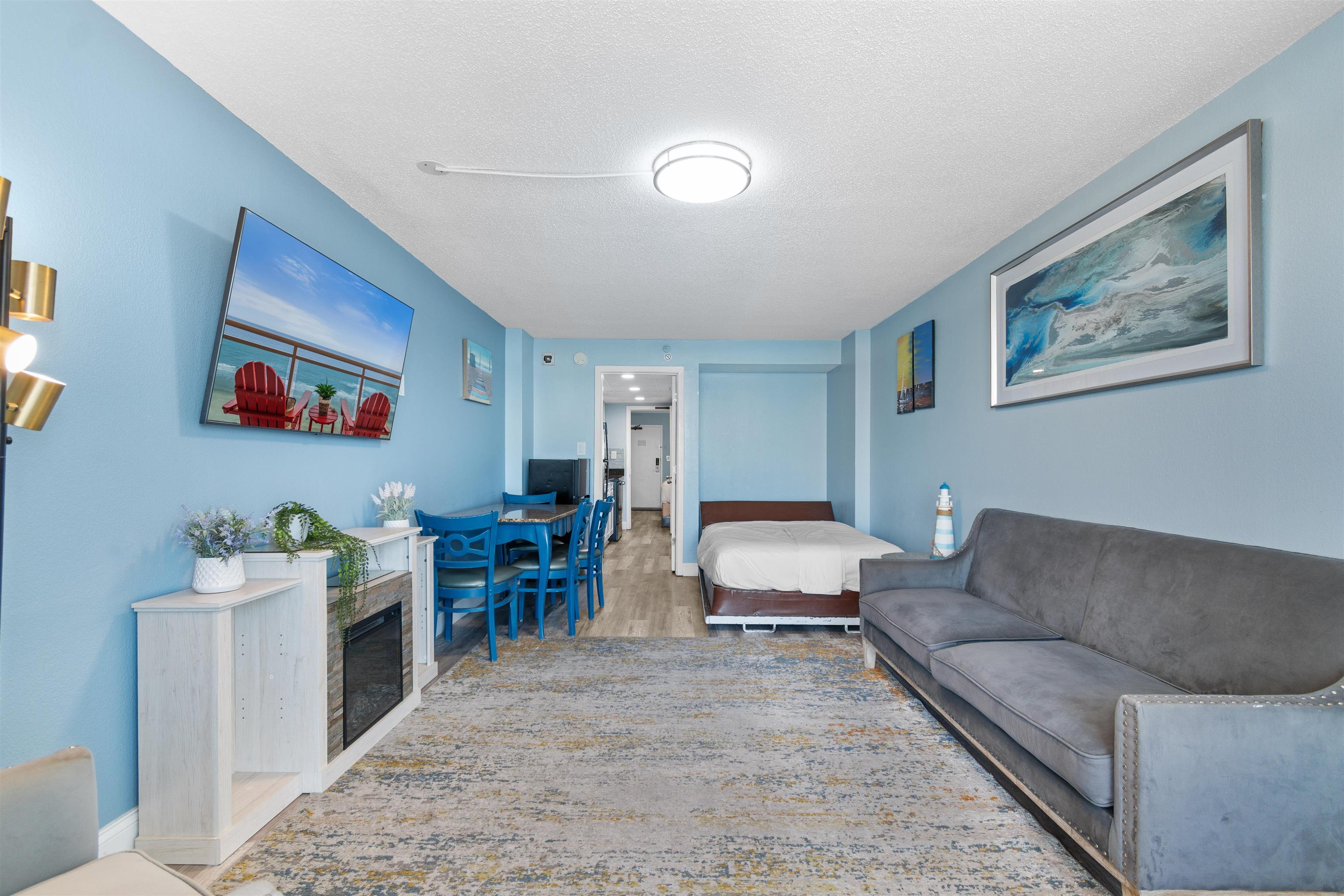 1501 South Ocean Boulevard, Unit 1237 Myrtle Beach, SC 29577 - Photo 25 of 40 Living area with a textured ceiling and wood finished floors