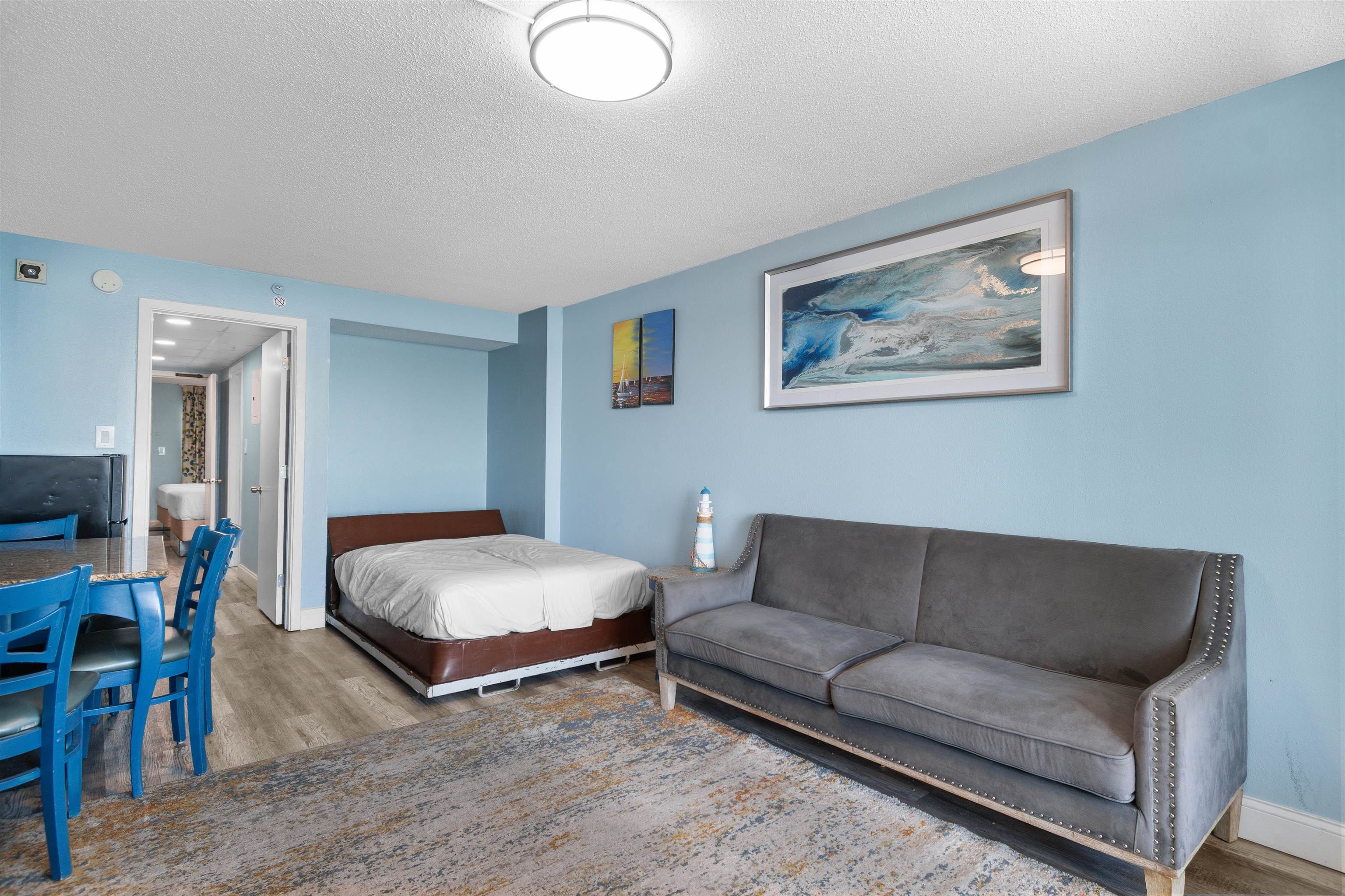 1501 South Ocean Boulevard, Unit 1237 Myrtle Beach, SC 29577 - Photo 26 of 40 Bedroom featuring wood finished floors and a textured ceiling
