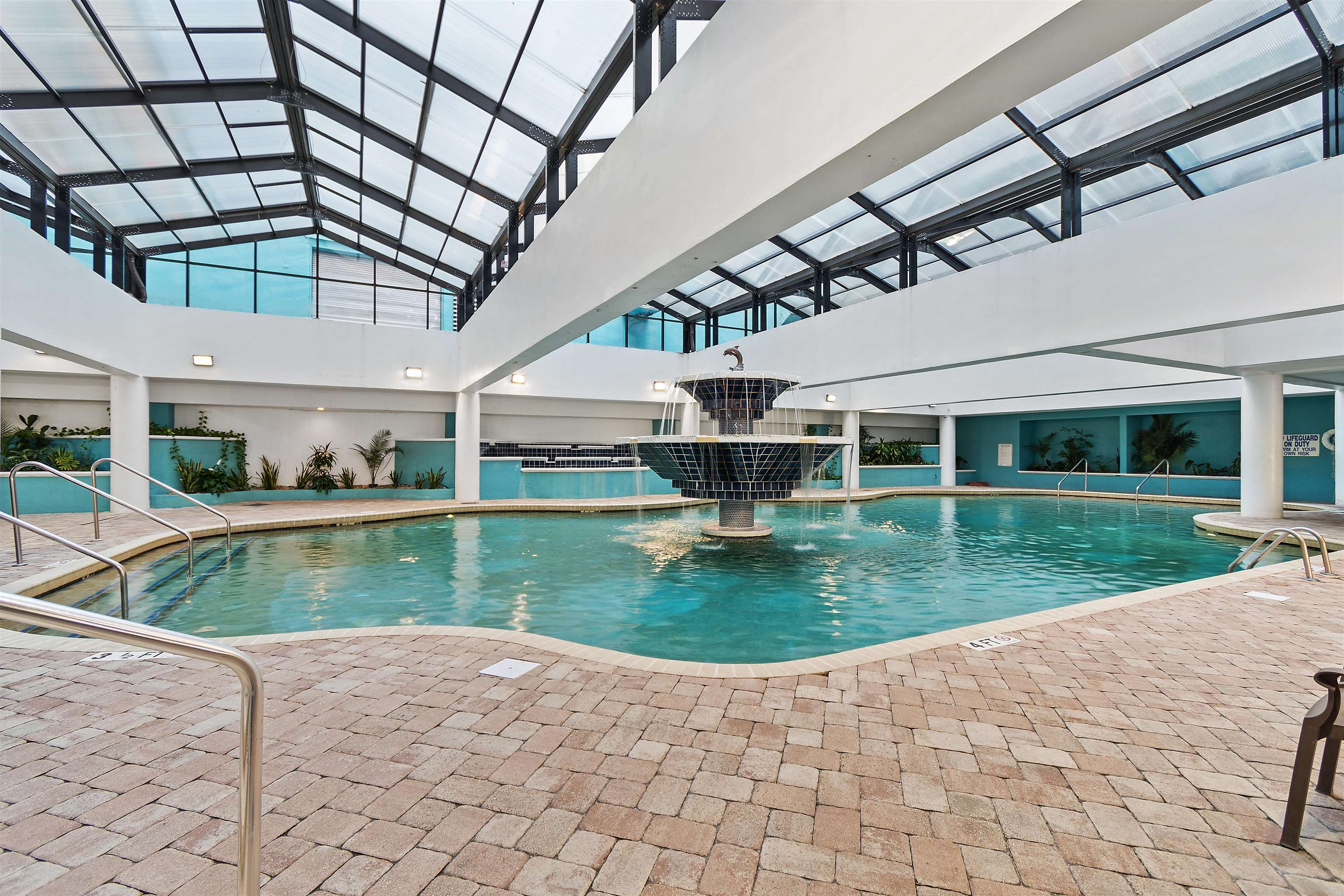 1501 South Ocean Boulevard, Unit 1237 Myrtle Beach, SC 29577 - Photo 33 of 40 Indoor community pool with a patio and a lanai