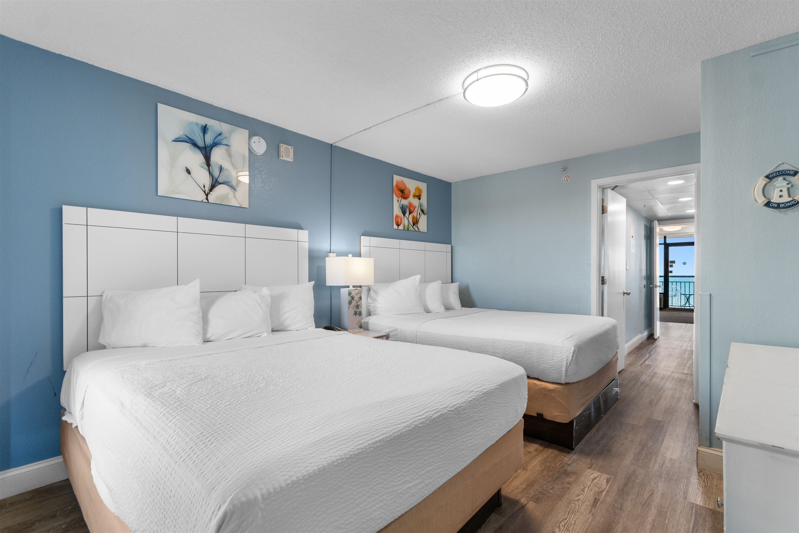 1501 South Ocean Boulevard, Unit 1237 Myrtle Beach, SC 29577 - Photo 7 of 40 Bedroom featuring dark wood-style floors and a textured ceiling
