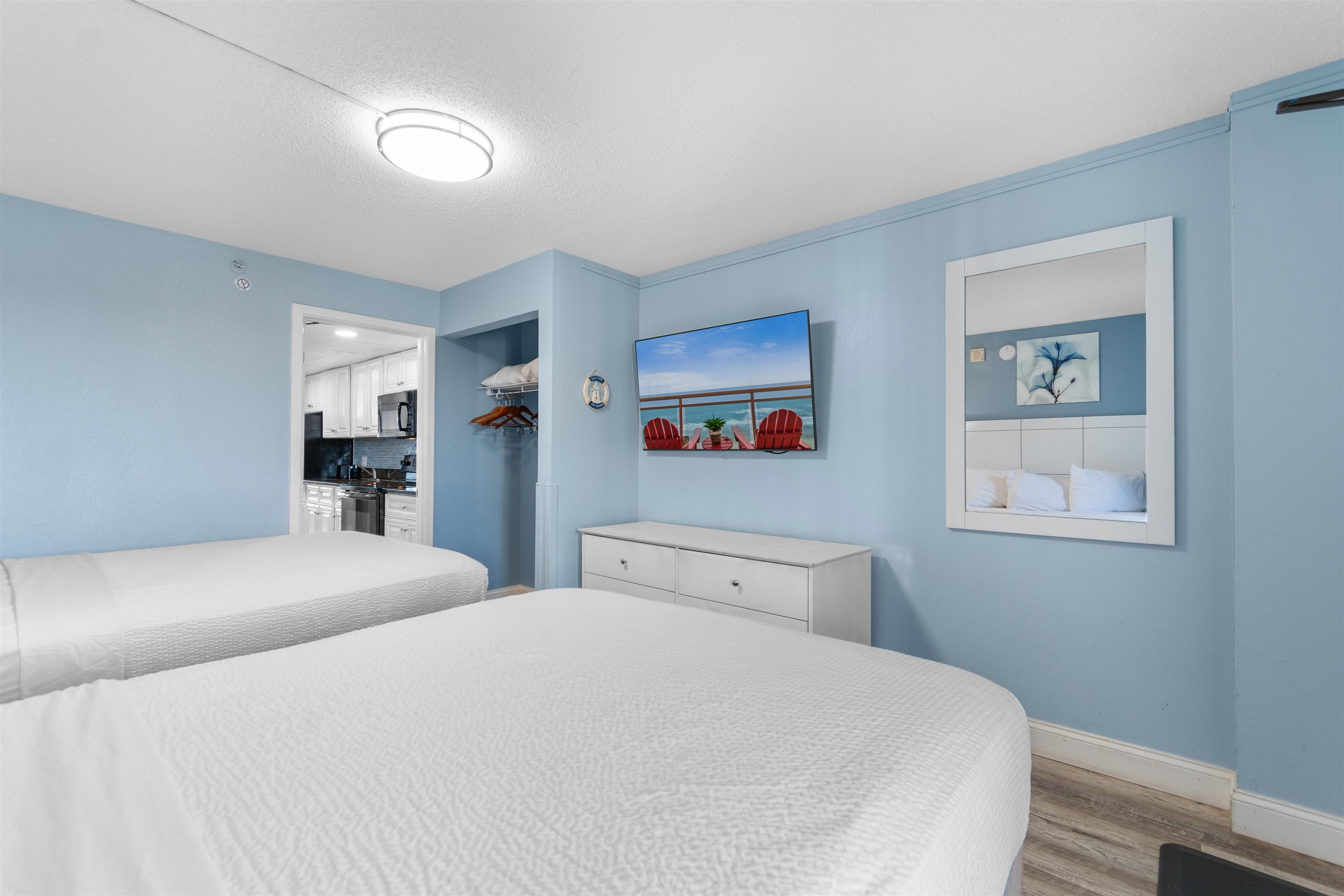 1501 South Ocean Boulevard, Unit 1237 Myrtle Beach, SC 29577 - Photo 8 of 40 Bedroom with wood finished floors and a textured ceiling