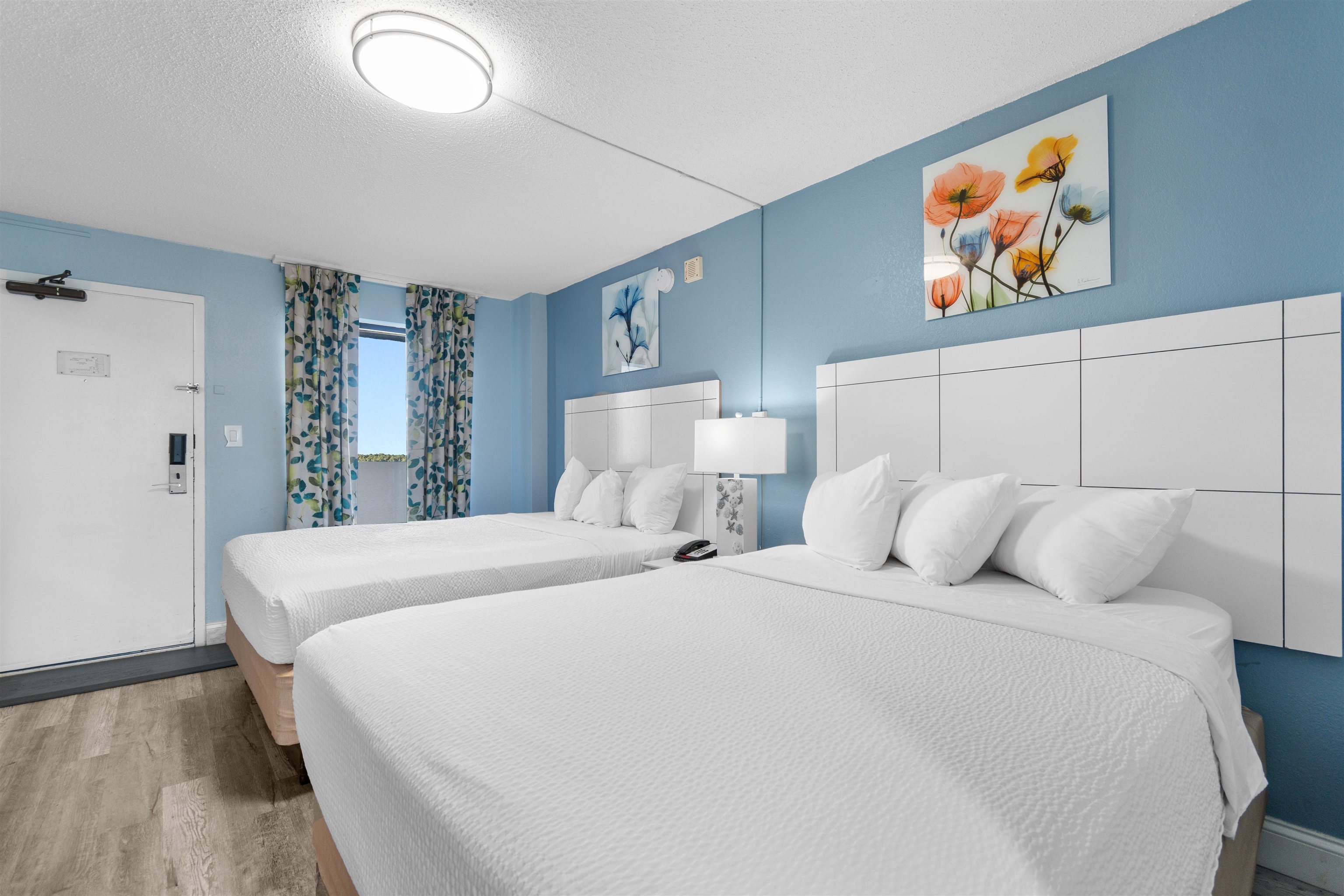 1501 South Ocean Boulevard, Unit 1237 Myrtle Beach, SC 29577 - Photo 9 of 40 Bedroom with a textured ceiling and wood finished floors